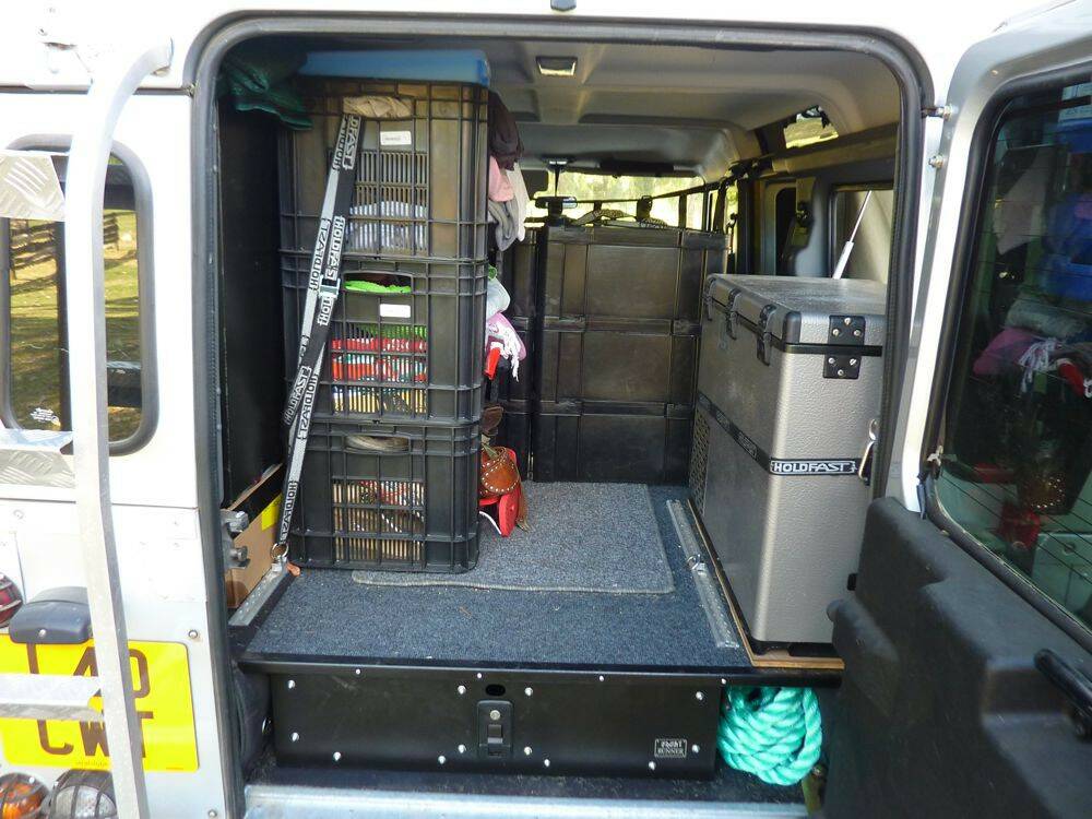 Rear-inside-view-of-Land-Rover-Defender-110-with-fridge-and-pull-out-drawer.jpg