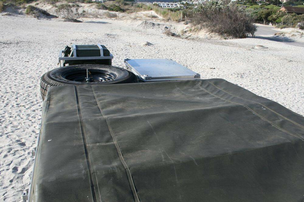 Land-Rover-Defender-110-roof-view-with-roof-tent-spare-tyre-ammo-box-jerry-cans.jpg