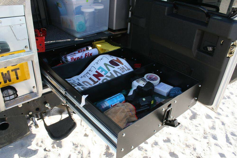Land-Rover-Defender-110-with-Overland-Kit-showing-handy-rear-pull-out-drawer.jpg
