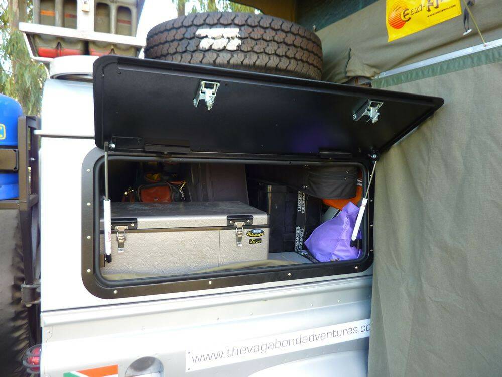 Land-Rover-Defender-110-with-Overland-Kit-showing-side-wing-open-access-to-fridg.jpg
