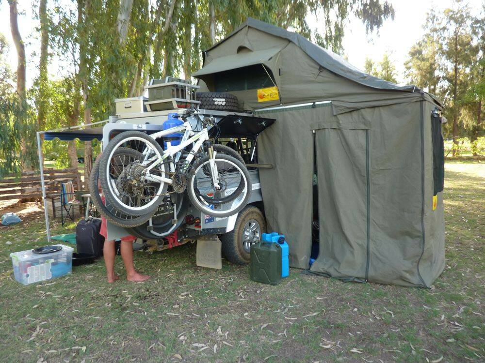 Land-Rover-Defender-110-with-roof-tent-and-skirt-setup.jpg