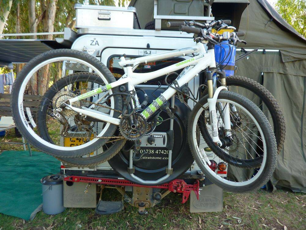 Bikes-mounted-on-Thule-2-bike-carrier-on-rear-of-Land-Rover-Defender-110.jpg
