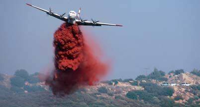 5%2010%20C-54G%20N82FA%20161%20in%20flight%20front%20retardent%20drop%20m.jpg